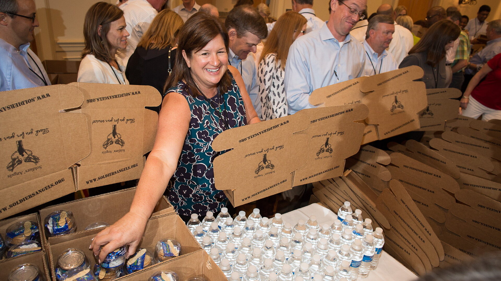 Volunteers packing supplies for military families